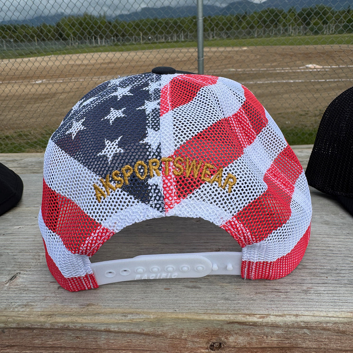AkS Bones Stripes Snap-Back Trucker hat in Navy, Red and Flag
