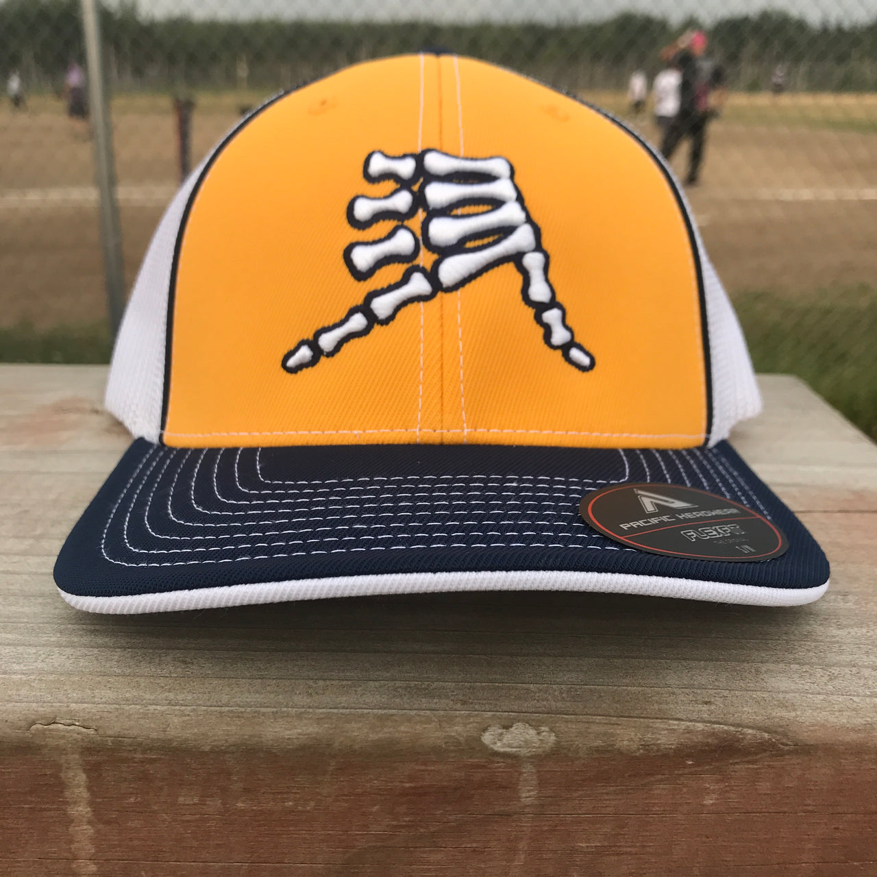 AkS Bones Trucker Hat in Yellow, Navy & White
