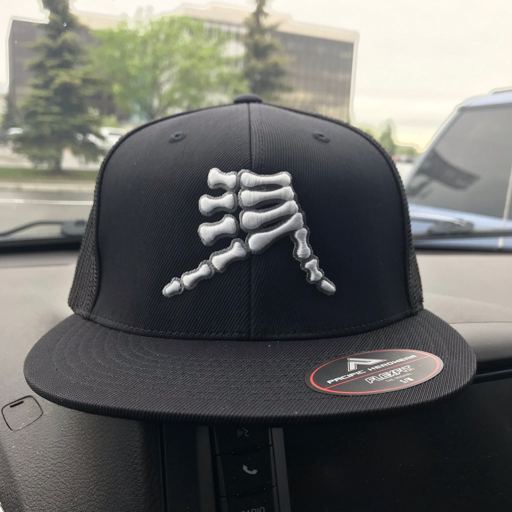AkS Bones Flatbill Trucker Hat in Black