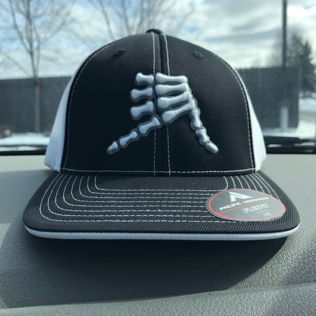 AkS Bones Flatbill Trucker hat in Black & White